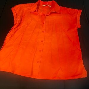 Emily Daniel’s Vibrant Orange Button-Up Blouse